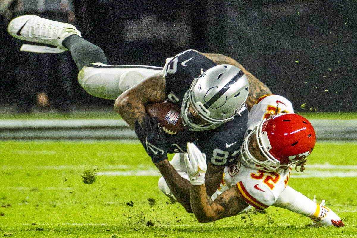 Raiders tight end Darren Waller (83) is tackled by Kansas City