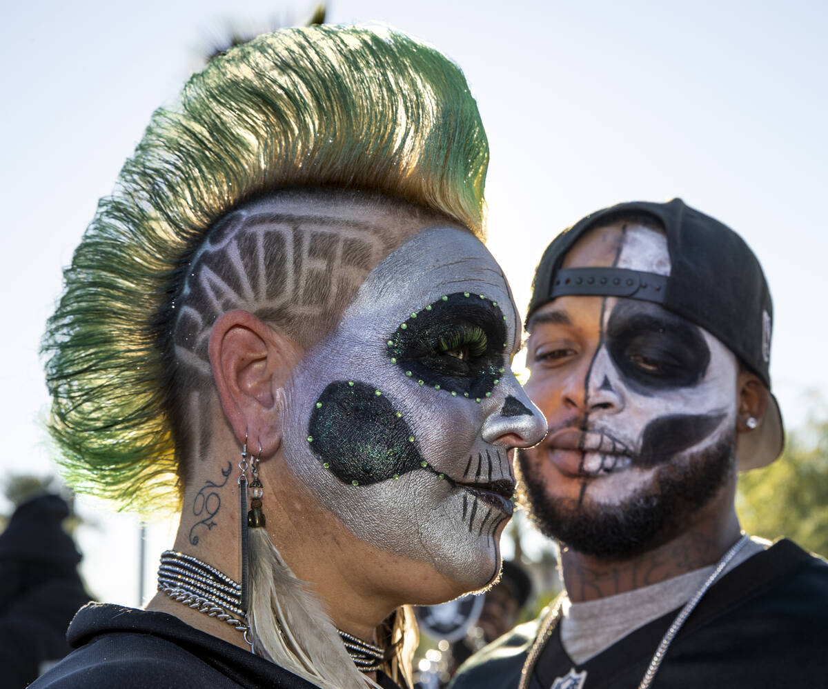 Raiders fans Jersey Tucker, left, and Jamal Jones stitchery  with friends successful  tailgating earlier  an N ...
