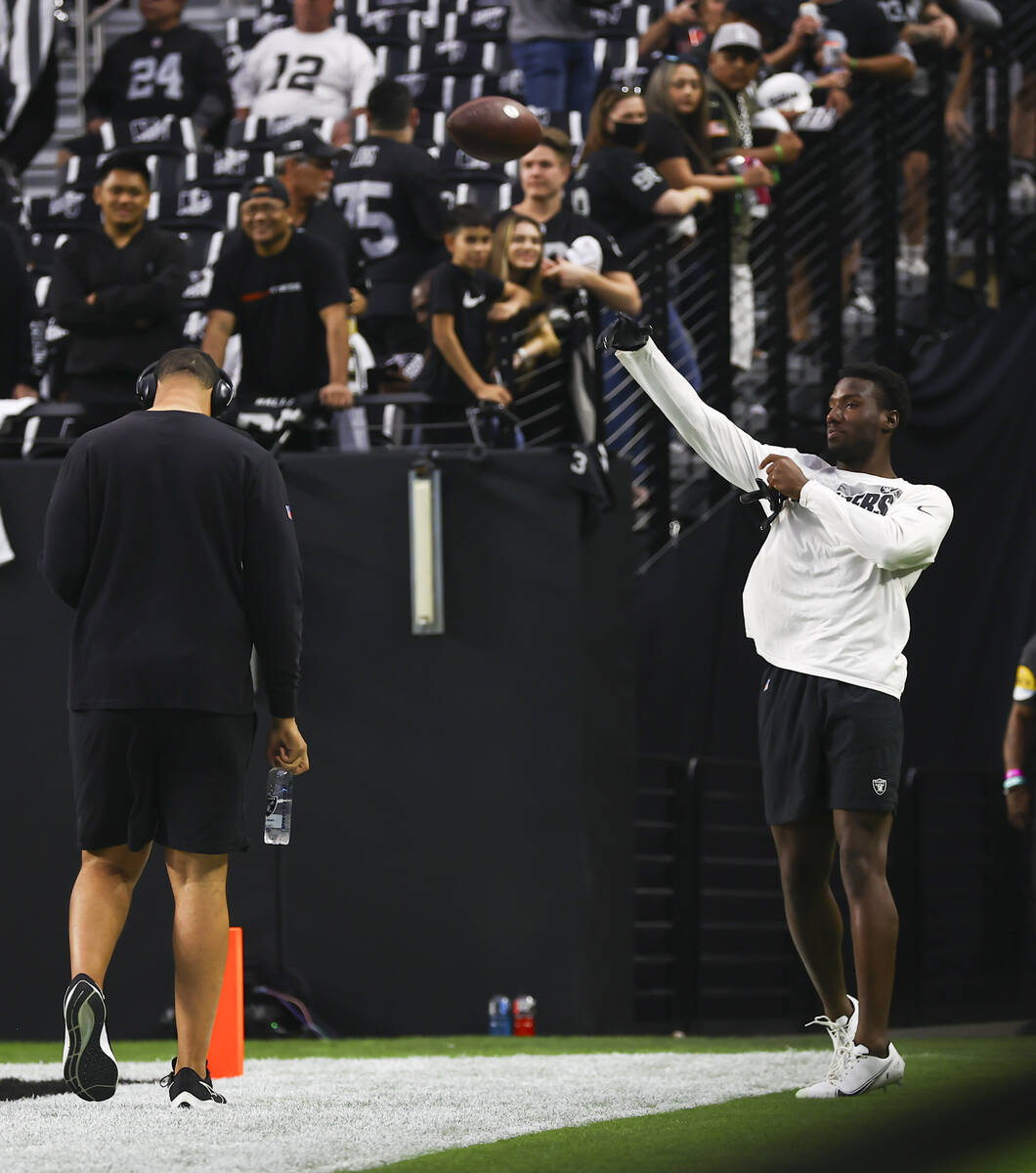 Raiders wide   receiver Bryan Edwards warms up   earlier  the commencement  of an NFL crippled  against the Kansas ...