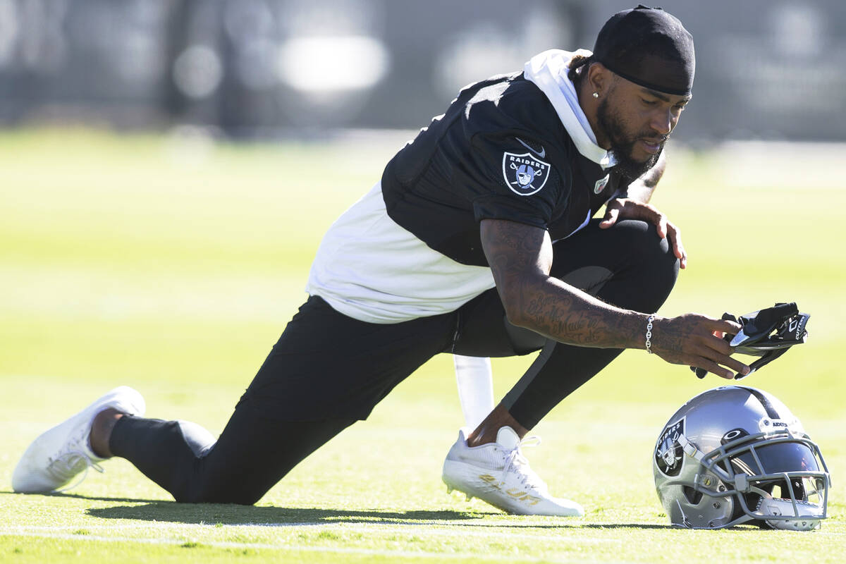 Raiders wide   receiver DeSean Jackson (1) grabs a brace  of gloves portion    stretching during a pract ...