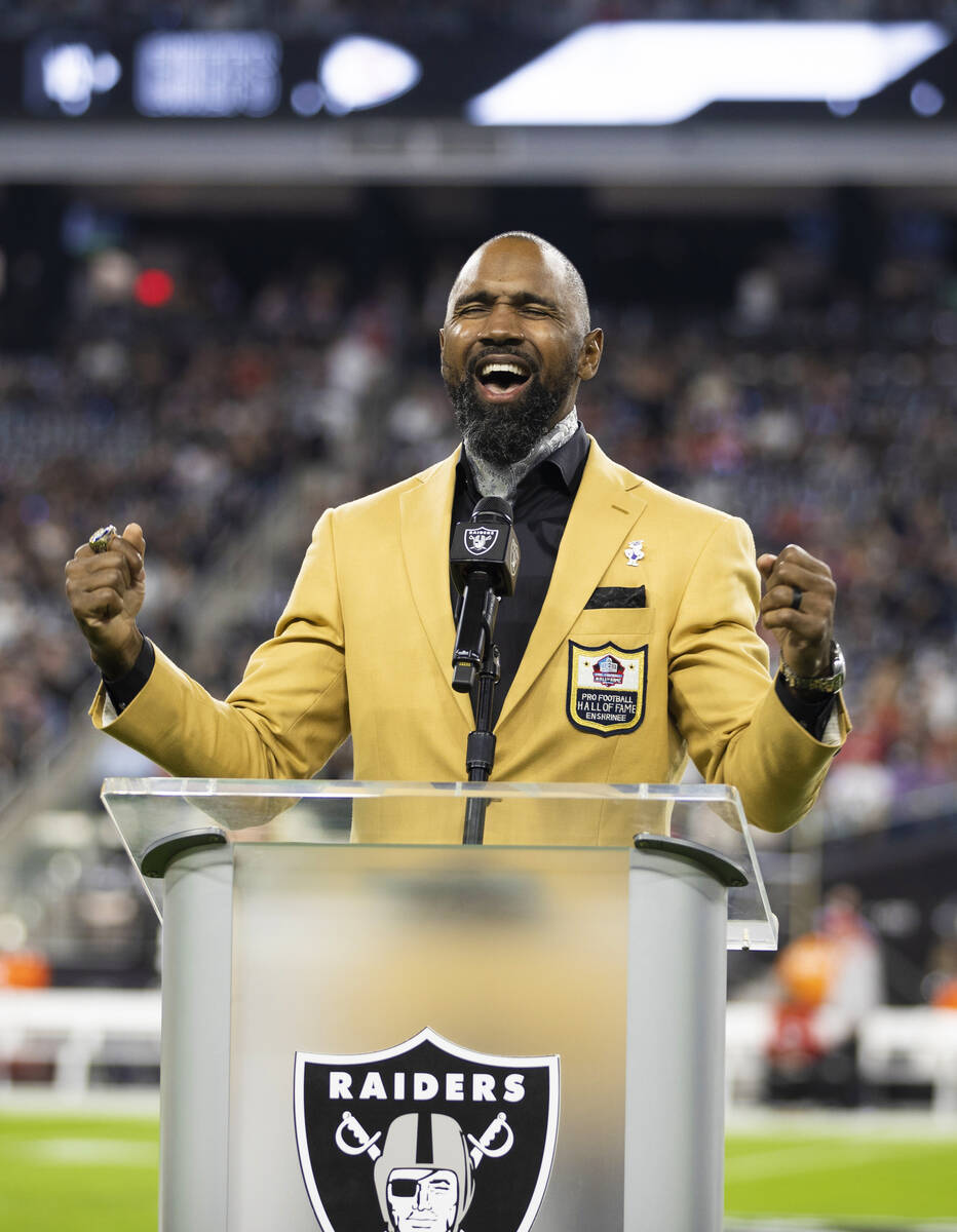 Raider Pro Football Hall of Fame inductee Charles Woodson speaks before the start of an NFL foo ...