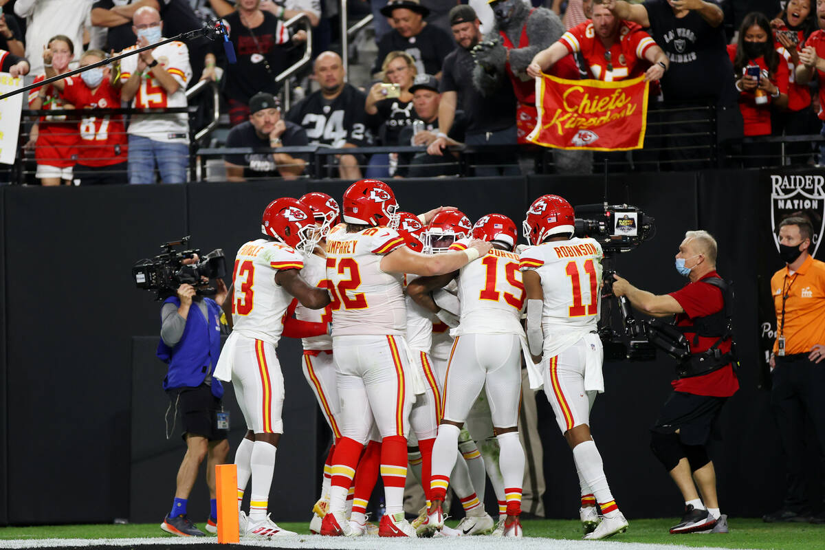 The Kansas City Chiefs celebrate a touchdown against the Raiders during the second half of an N ...