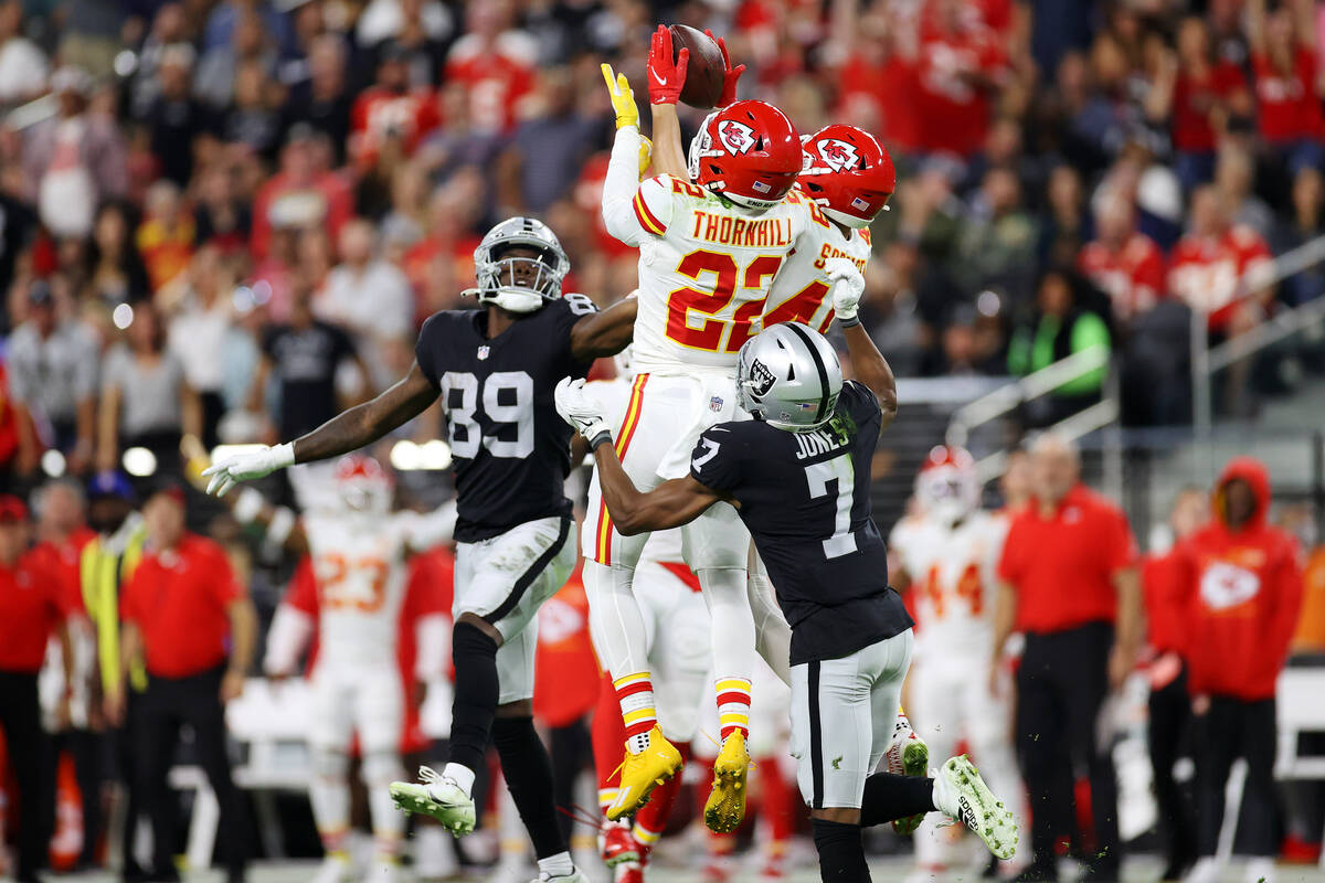 Kansas City Chiefs safety Daniel Sorensen (49) intercepts the ball next to teammate safety Juan ...