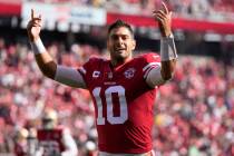 San Francisco 49ers quarterback Jimmy Garoppolo reacts toward fans before an NFL football game ...
