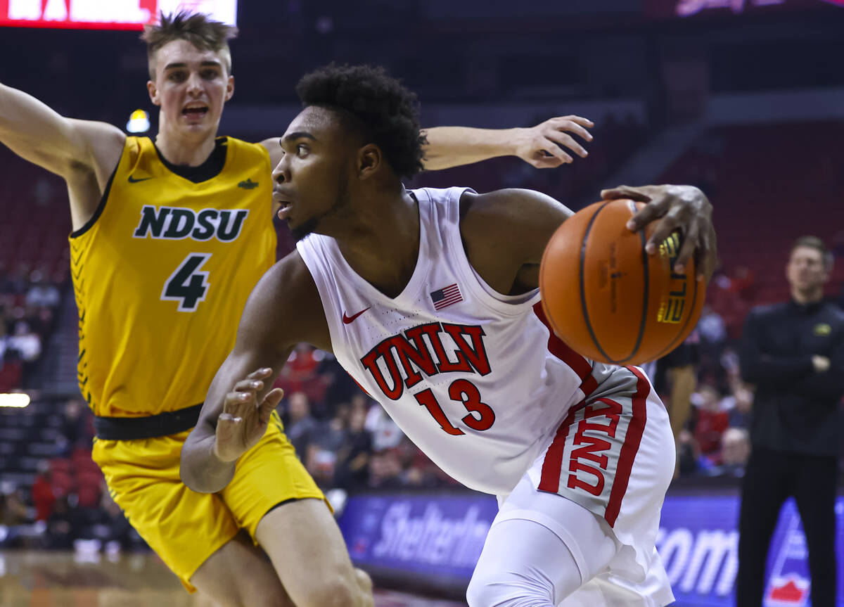 UNLV Rebels guard Bryce Hamilton (13) drives the ball against North Dakota State Bison forward ...