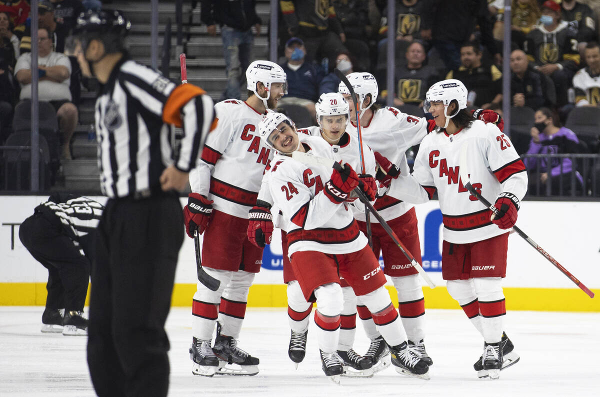 Carolina Hurricanes center Seth Jarvis (24) celebrates a third period goal with teammates durin ...