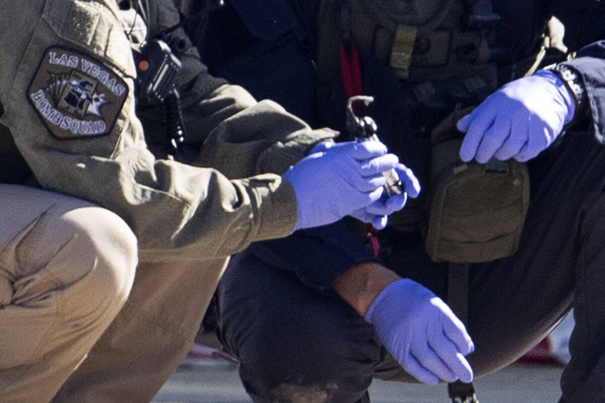The Las Vegas Fire Department bomb squad officers are investigating a suspicious device in down ...