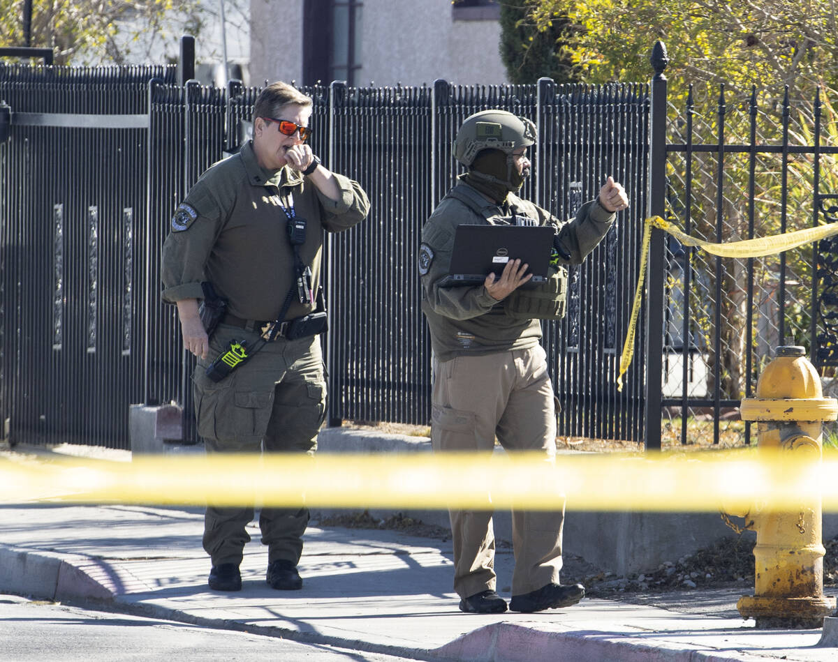 The Las Vegas Fire Department bomb squad officers are investigating a suspicious device in down ...