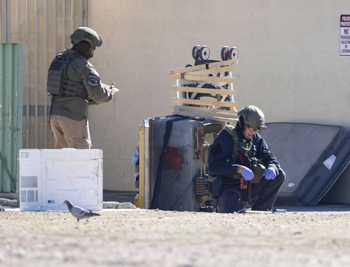 The Las Vegas Fire Department bomb squad officers are investigating a suspicious device in down ...
