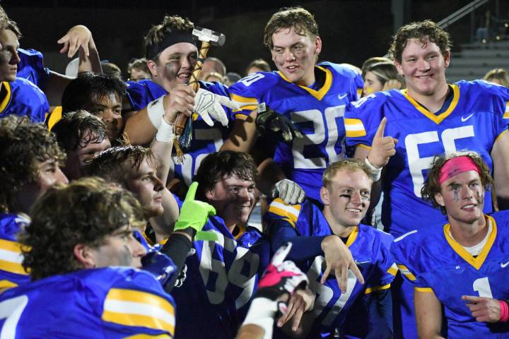 Moapa Valley seniors pose with the Hammer following a 46-28 victory over Virgin Valley on Frida ...