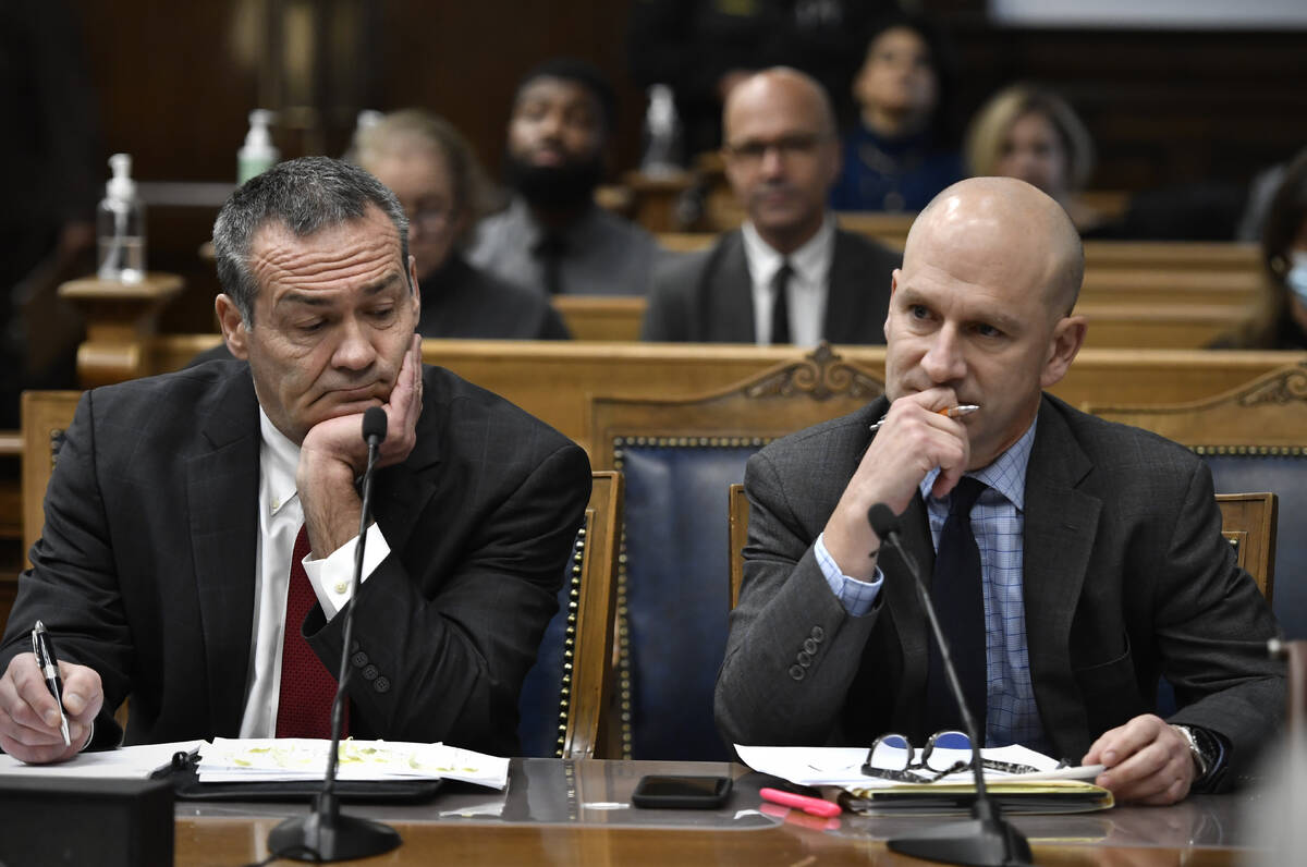 Kyle Rittenhouse's attorneys, Mark Richards, left, and Corey Chirafisi, listen as Judge Bruce S ...