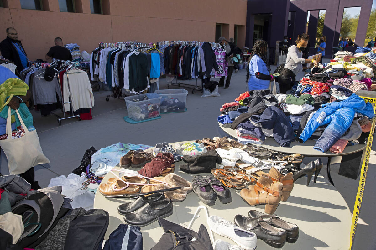 Participants browse through free clothes during the annual Project Homeless Connect at Pearson ...