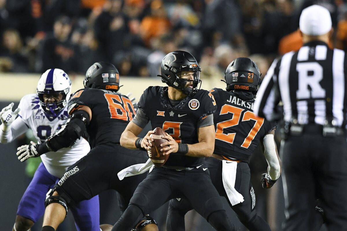 Oklahoma State quarterback Spencer Sanders (3) throws Pass during an NCAA college football game ...