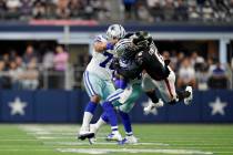 Atlanta Falcons linebacker Dante Fowler Jr. (6) dives to make the tackle on CeeDee Lamb (88) du ...