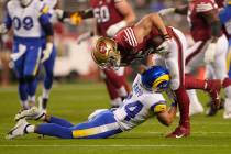 San Francisco 49ers tight end George Kittle, top, runs against Los Angeles Rams free safety Tay ...