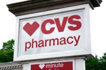 This is a CVS Pharmacy sign shown in Mount Lebanon, Pa., on Monday May 3, 2021. (AP Photo/Gene ...