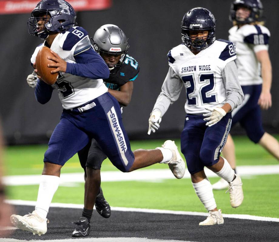 Shadow Ridge linebacker Mason White (5) scored a touchdown followed by his teammate Jaquieze Ho ...