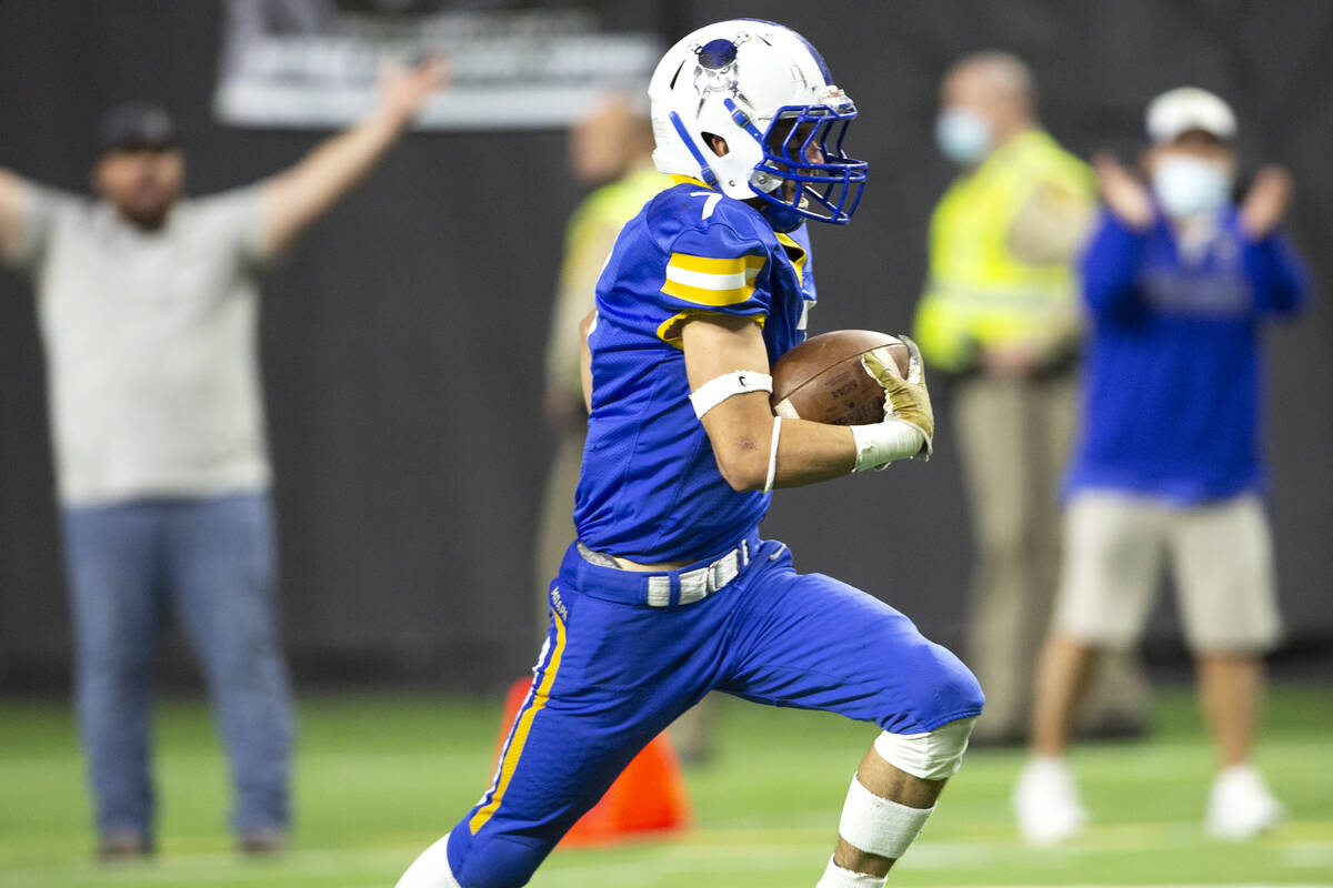 Moapa Valleyճ Jayme Carvajal (7) runs through the endzone after catching an interception ...