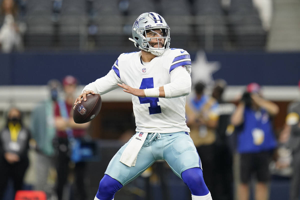 Dallas Cowboys quarterback Dak Prescott (4) looks to pass during an NFL football game against t ...