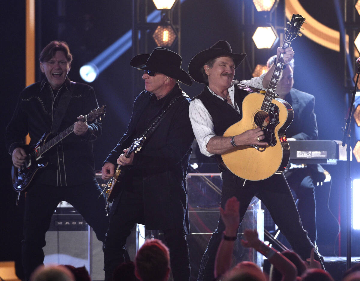 Kix Brooks, right, of Brooks & Dunn, performs "Brand New Man" at the 54th annual ...