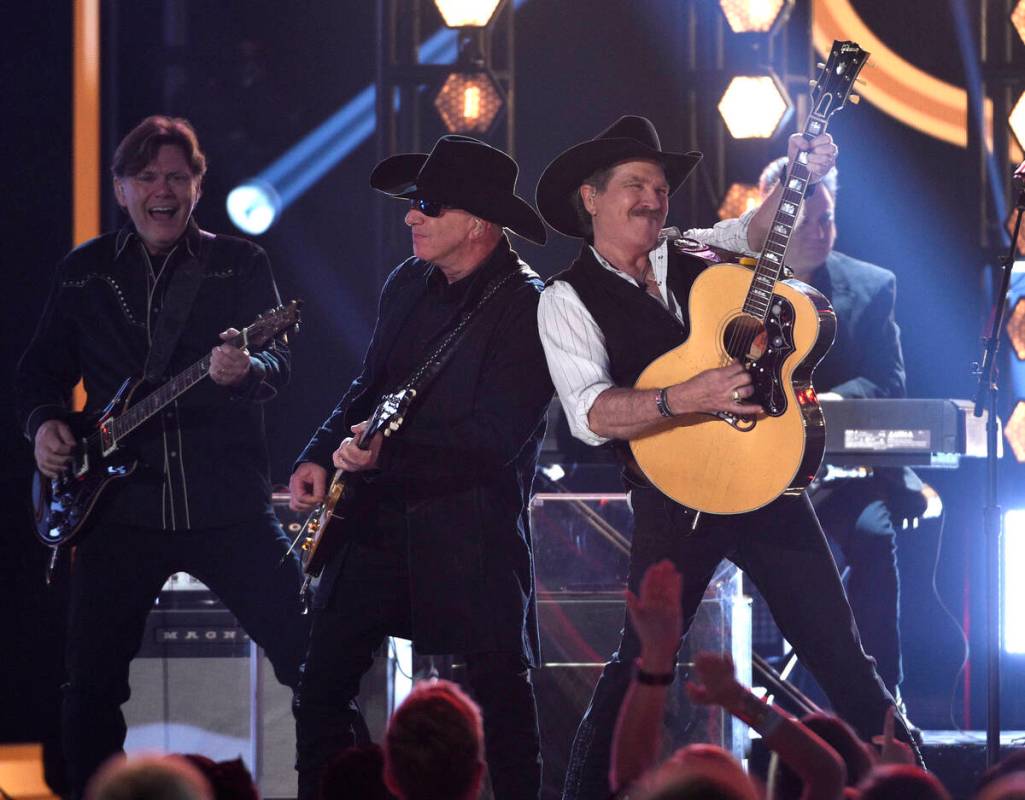 Kix Brooks, right, of Brooks & Dunn, performs "Brand New Man" at the 54th annual ...