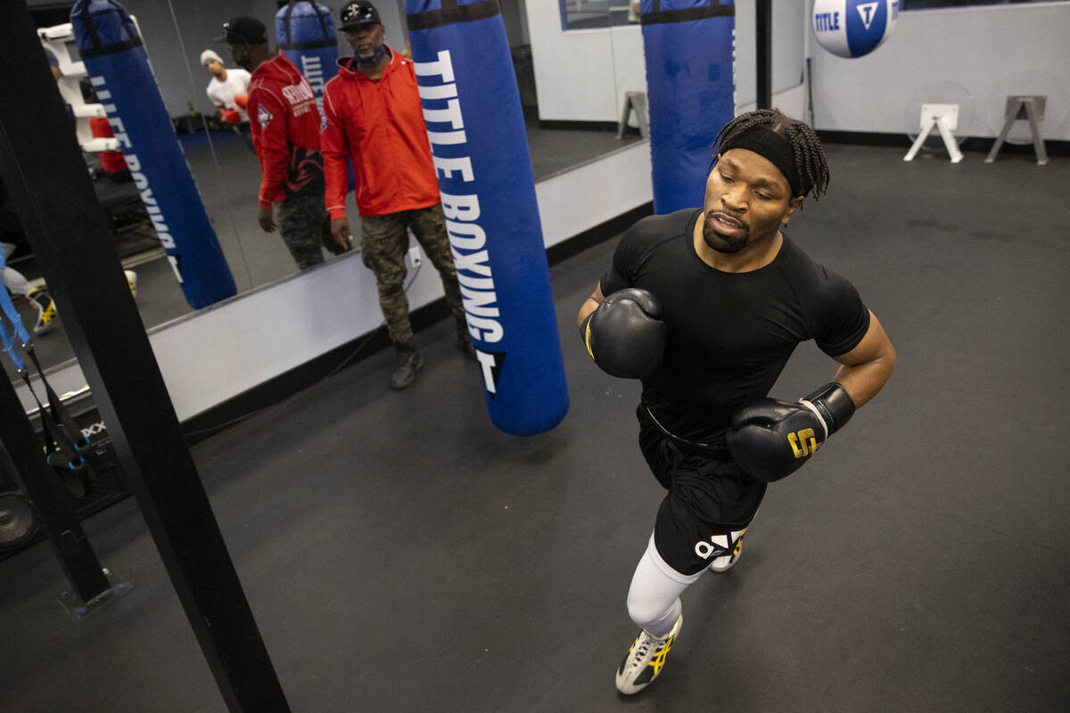 Shawn Porter runs laps around a boxing ring during a workout in preparation for an upcoming fig ...