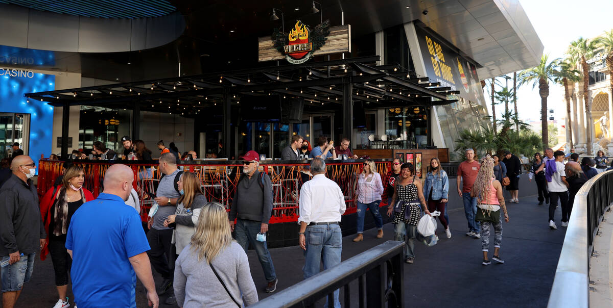 People walk at Harrah's on the Strip in Las Vegas Monday, Nov. 22, 2021. (K.M. Cannon/Las Vegas ...