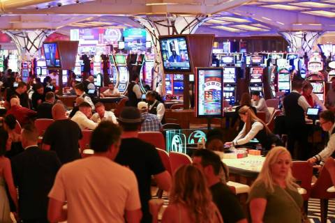 People gamble on the casino floor as Resorts World Las Vegas opens to the public on Thursday, J ...