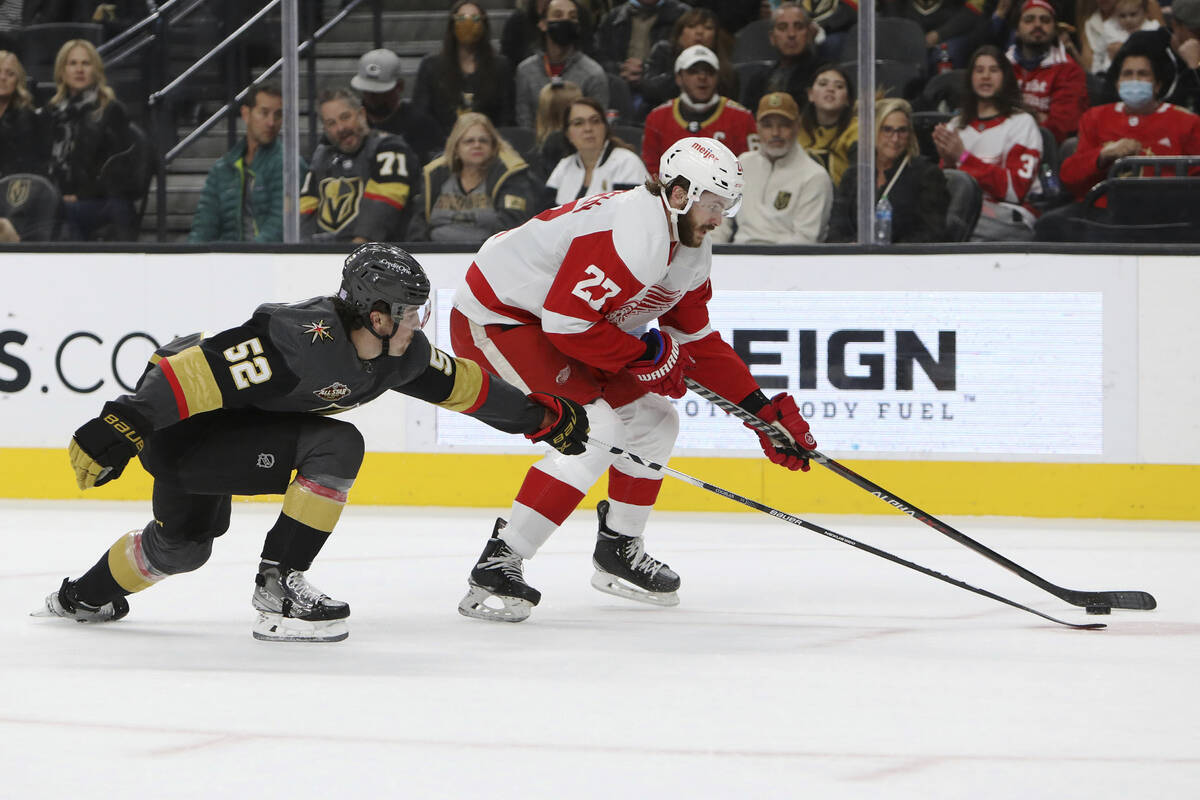 Vegas Golden Knights defenseman Dylan Coghlan (52) goes for a steal against Detroit Red Wings c ...