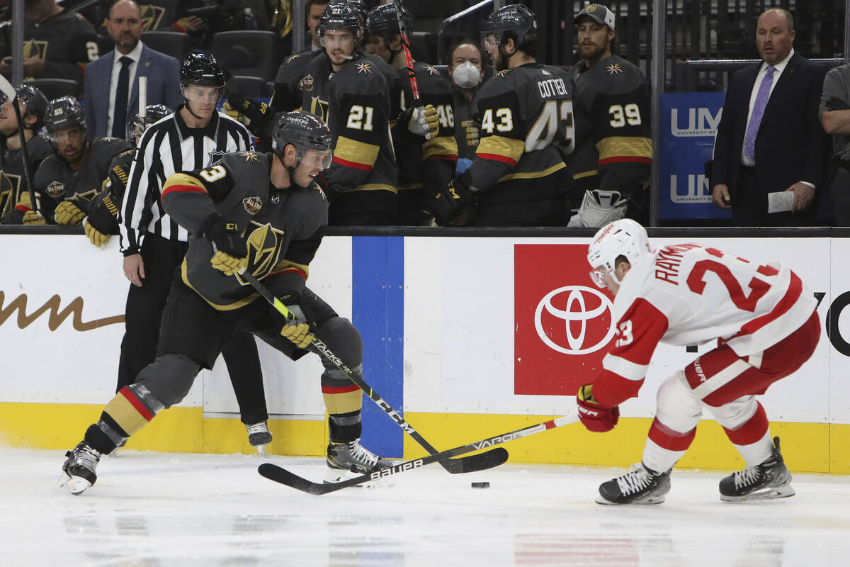 Vegas Golden Knights defenseman Brayden McNabb (3) grabs the puck against Detroit Red Wings rig ...