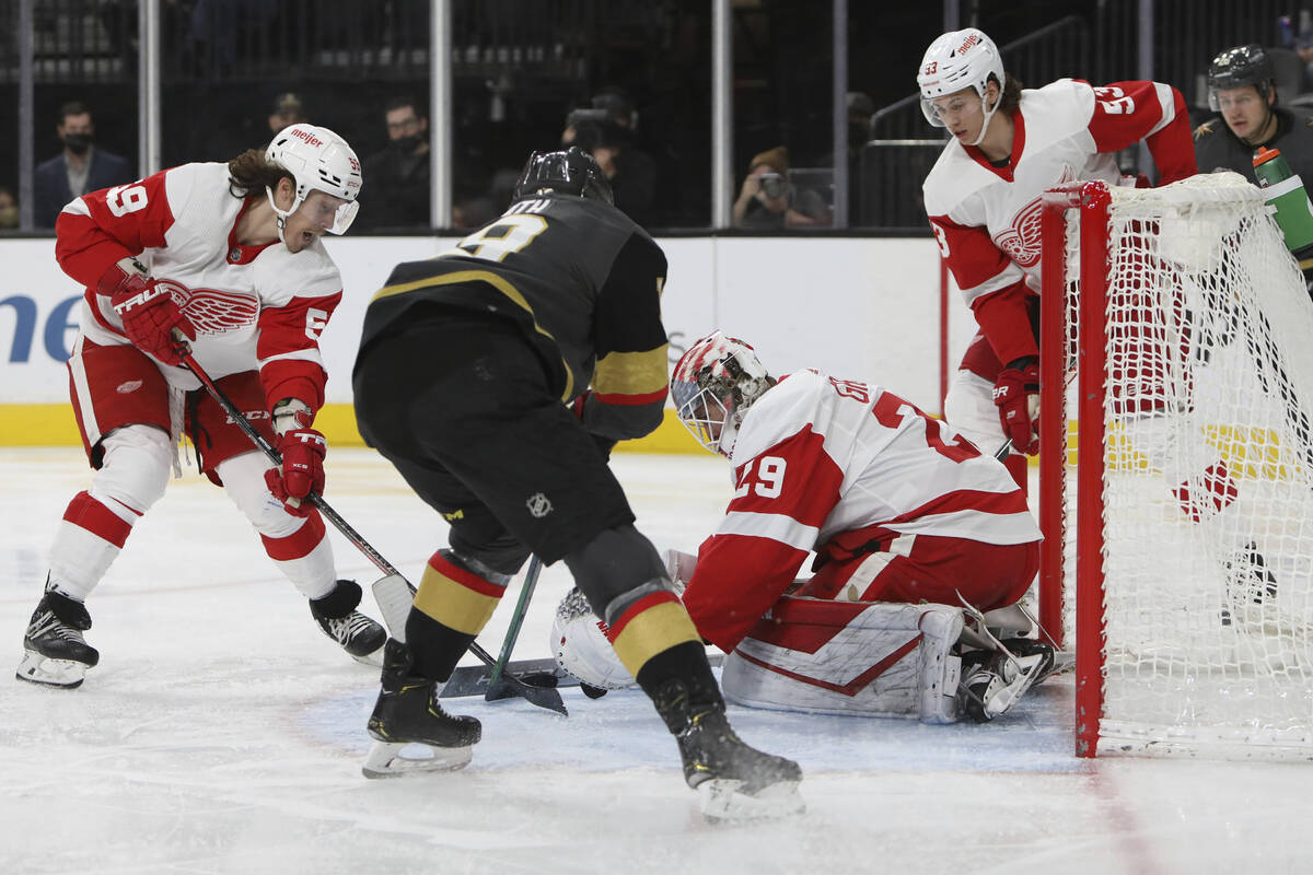 Detroit Red Wings goaltender Thomas Greiss (29) covers up the puck against Vegas Golden Knights ...
