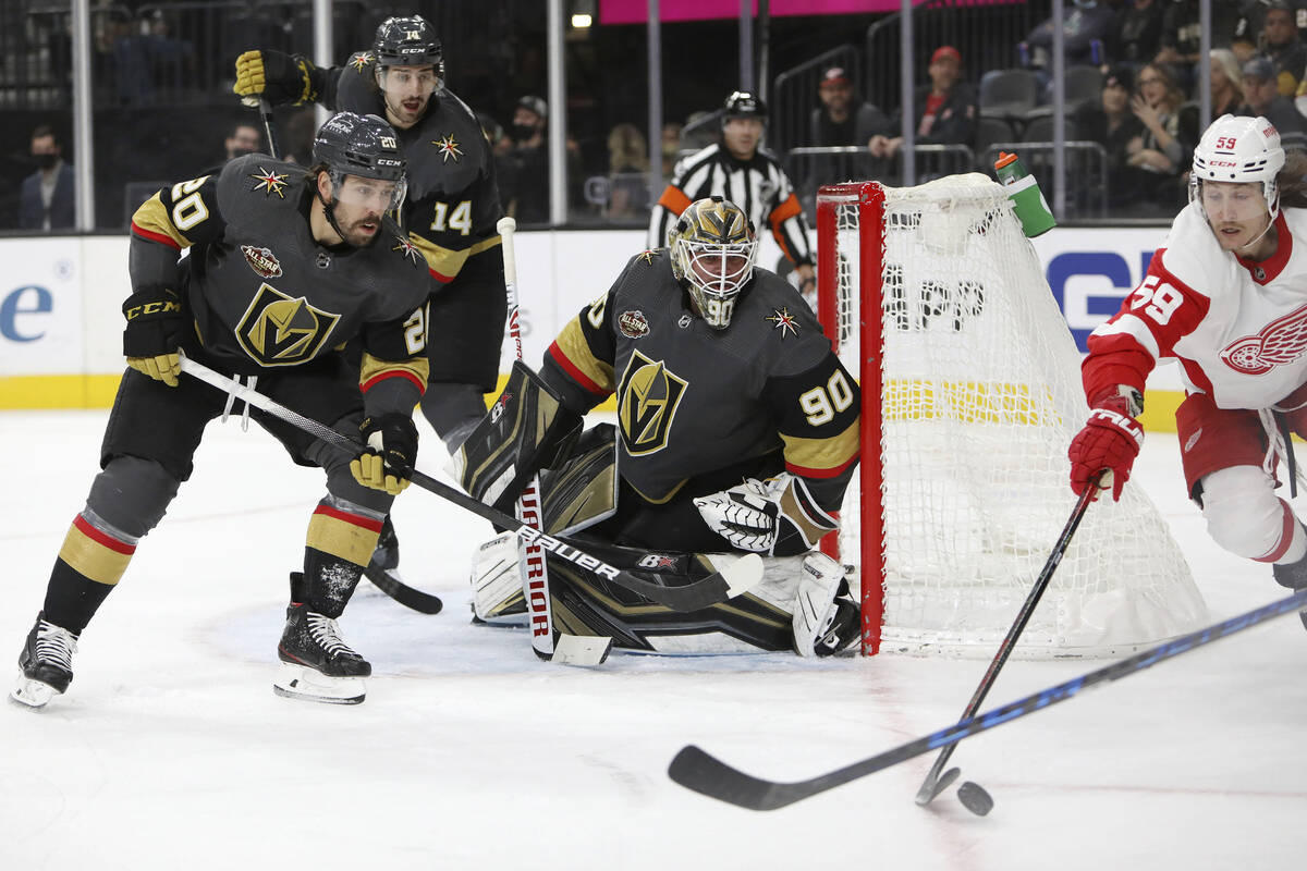 Vegas Golden Knights center Chandler Stephenson (20), defenseman Nicolas Hague (14) and goalten ...