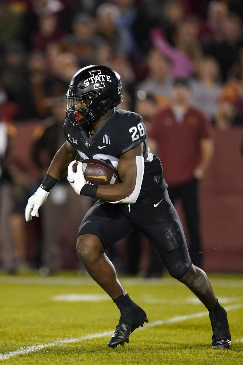 Iowa State running back Breece Hall (28) carries the ball up field during the first half of an ...
