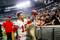 Kansas City Chiefs quarterback Patrick Mahomes (15) celebrates after defeating the Raiders 41-1 ...