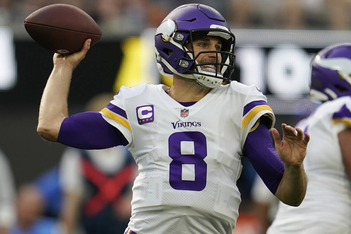 Minnesota Vikings quarterback Kirk Cousins (8) prepares to throw a pass during the first half o ...