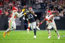 Raiders tight end Darren Waller (83) reaches for the football as Kansas City Chiefs safety Juan ...