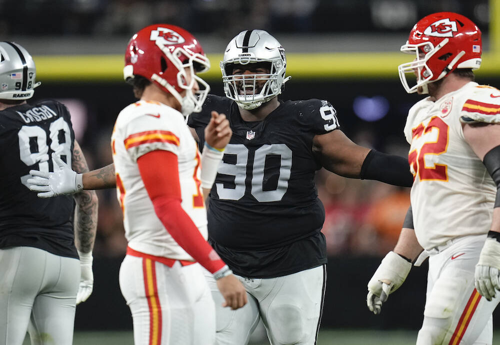 Las Vegas Raiders defensive tackle Johnathan Hankins (90) reacts after a penalty during the thi ...