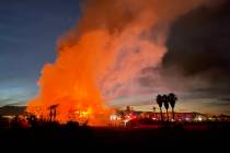 Firefighters work to put out a fire at a vacant clubhouse at Silverstone Golf Club on Friday, N ...