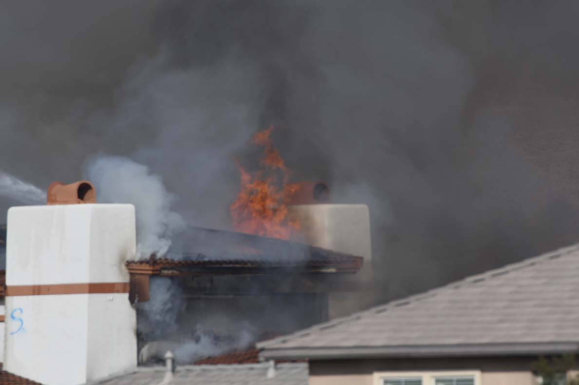 Fire breaks through the roof of the the vacant clubhouse at the Silverstone Golf Club on Friday ...