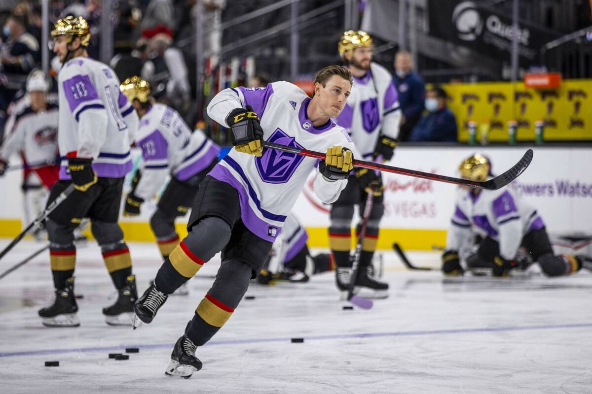 Hockey Fights Cancer warm up jerseys hang in the Colorado