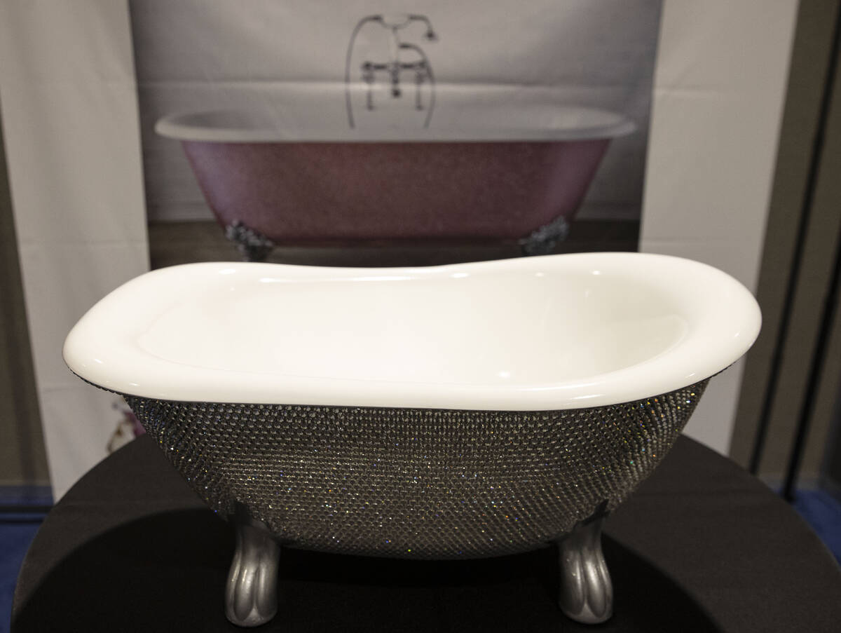 A bathtub, studded with silver Swarovski crystal, is displayed at Big Boys Toys, the world's pr ...