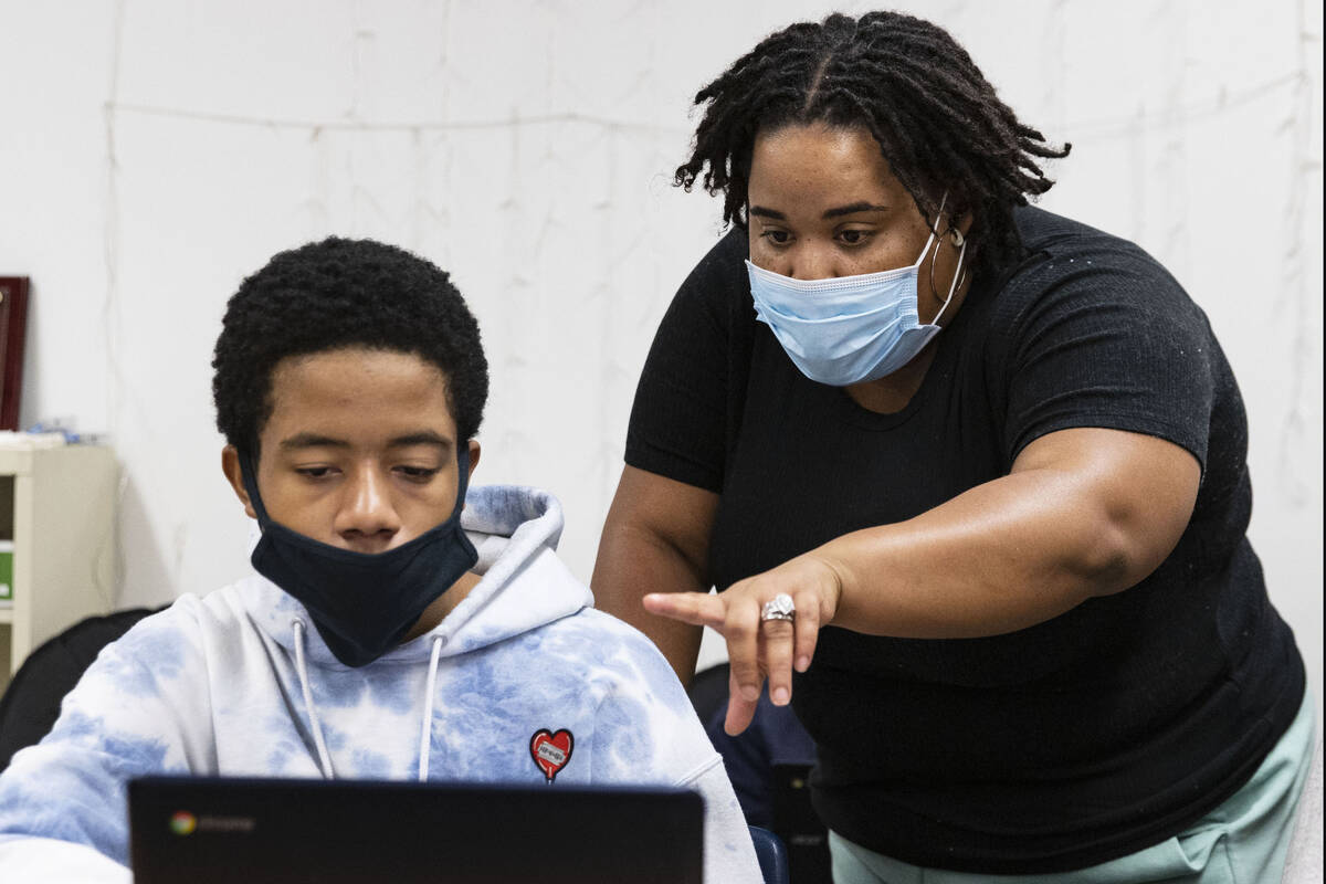 Chanel Davison, right, a specialist of Jobs 4 Nevada Graduates (J4NG), works with Chaparral Hi ...