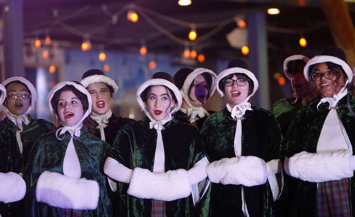Las Vegas Academy of the Arts Choir members perform before a tree lighting ceremony of The Linq ...