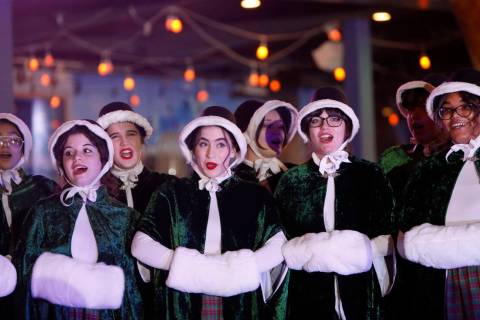 Las Vegas Academy of the Arts Choir members perform before a tree lighting ceremony of The Linq ...