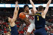 UNLV Rebels guard Keshon Gilbert (10) shoots over Michigan Wolverines forward Caleb Houstan (22 ...