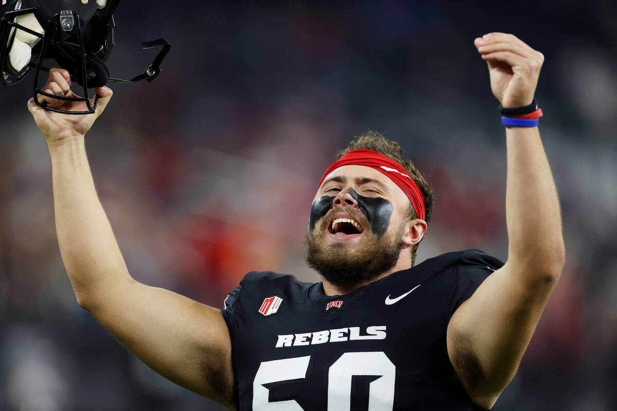 UNLV Rebels defensive lineman Jalen Dixon (50) fires up the crowd on a third down defensive pla ...