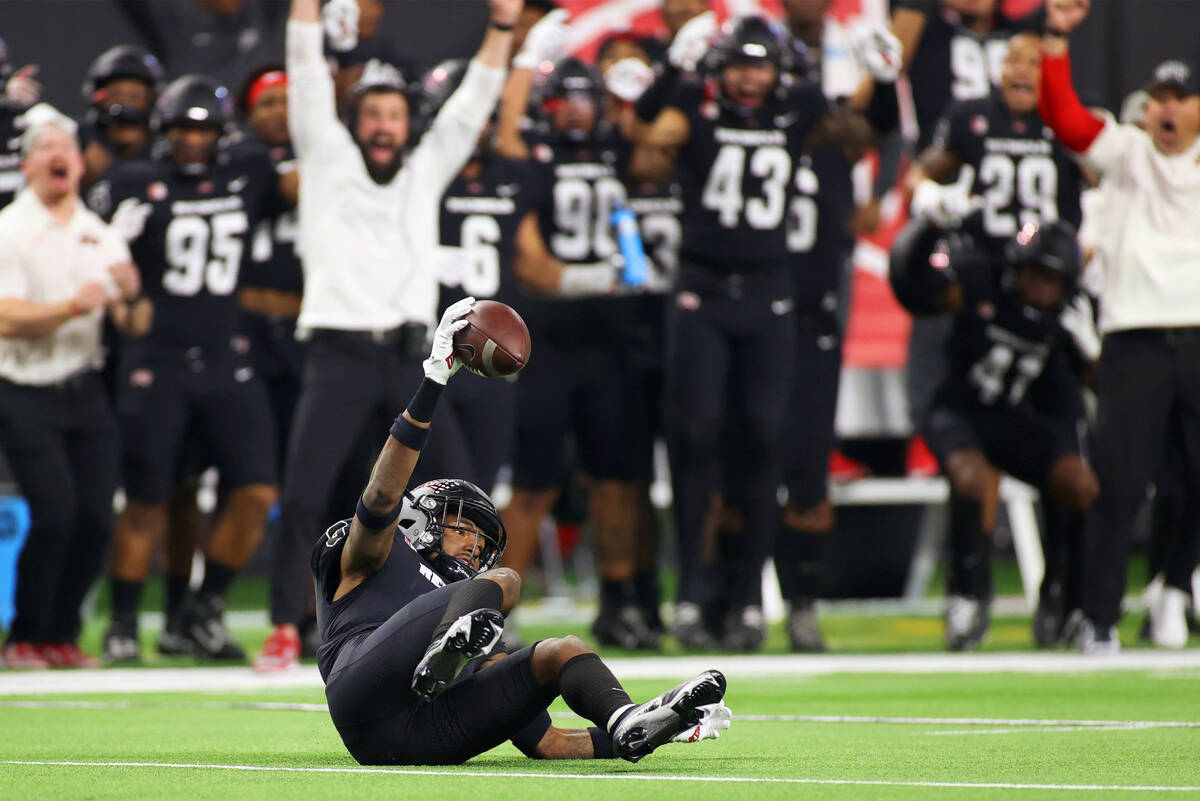 UNLV Rebels defensive back Ricky Johnson (0) intercepts the ball against the San Diego State Az ...