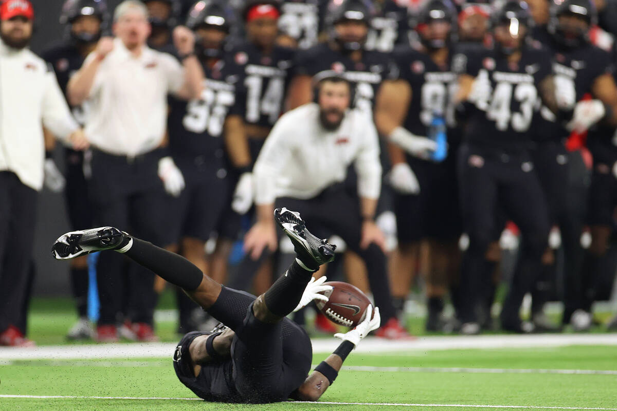 UNLV Rebels defensive back Ricky Johnson (0) intercepts the ball against the San Diego State Az ...