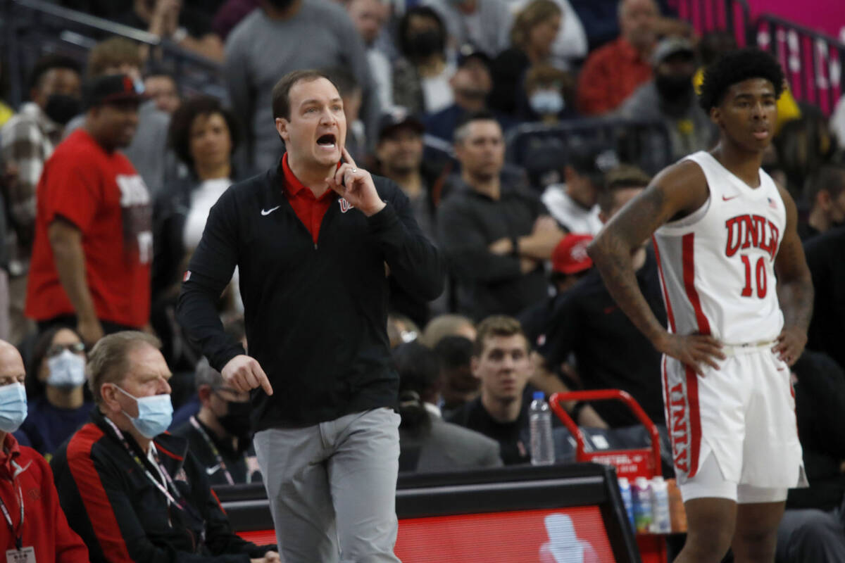 UNLV Rebels head coach Kevin Kruger and UNLV Rebels guard Keshon Gilbert (10) watch the game du ...