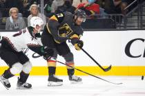 Golden Knights left wing Max Pacioretty (67) makes a shot on goal as Coyotes defenseman Victor ...